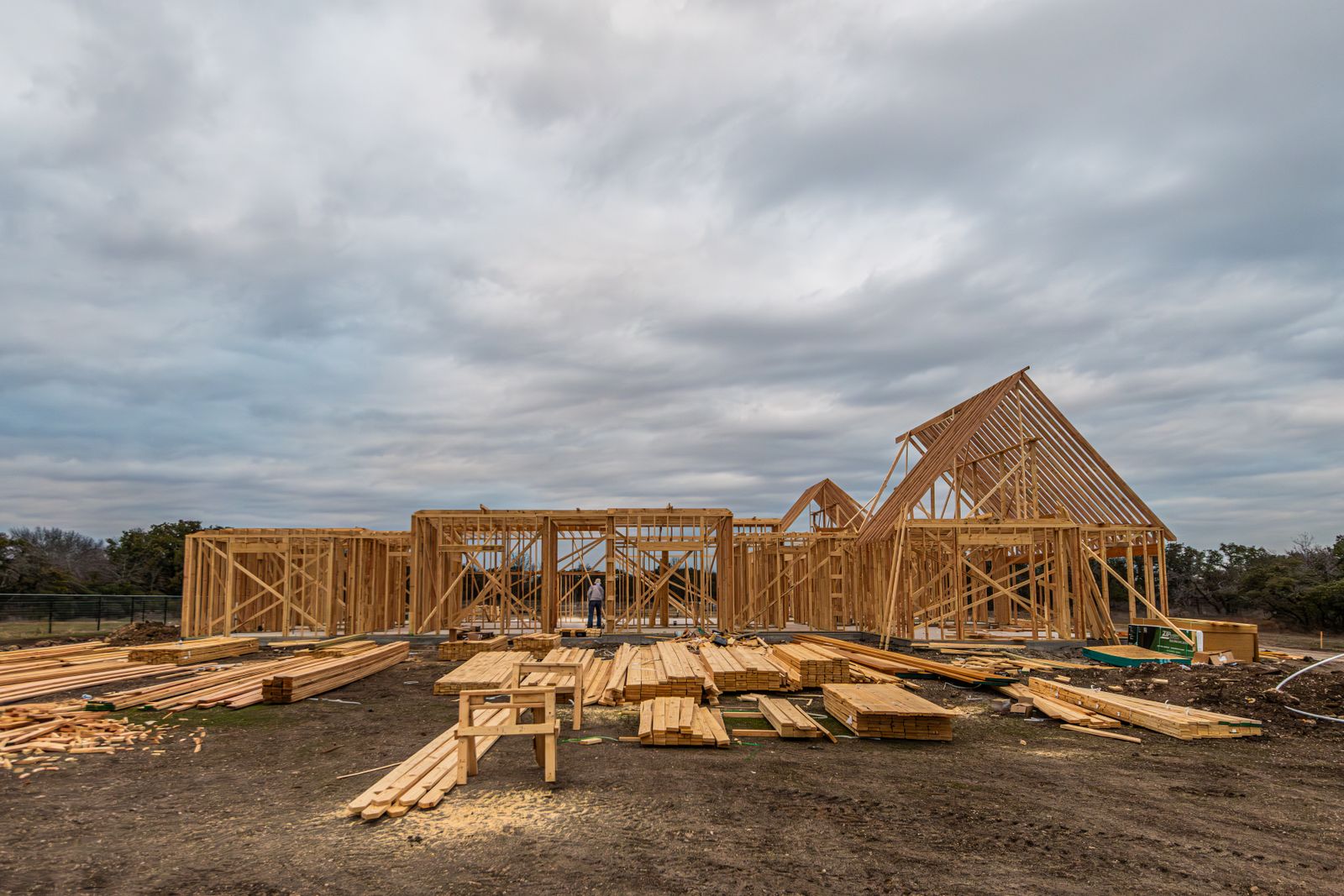 Home addition under construction with new framing and roof line