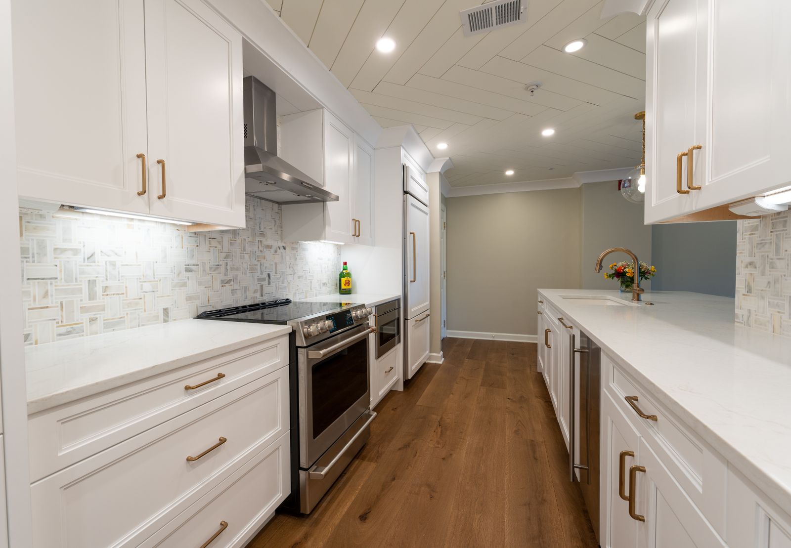 Renovated St. Louis kitchen with a new island, stone counters and custom cabinetry