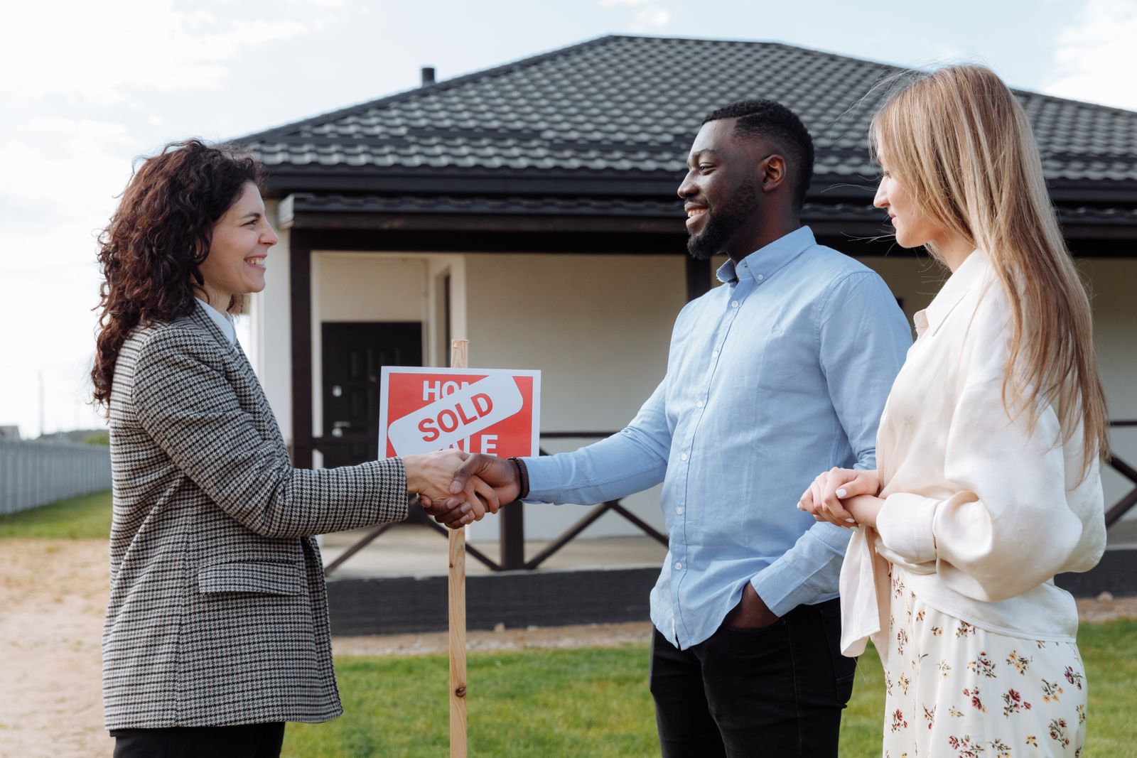 Contractor and homeowner shaking hands after a completed project